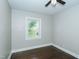 Cozy bedroom featuring refinished hardwood floors and a window view to the outdoors at 2112 Mckinney St, Burlington, NC 27217