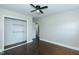 Bright bedroom with hardwood floors, ceiling fan, closet and a view to the hallway at 2112 Mckinney St, Burlington, NC 27217