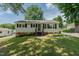 Charming single-story home with a well-manicured lawn, wood stairs, and a traditional design at 2112 Mckinney St, Burlington, NC 27217