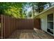 Fenced backyard features a cozy patio for enjoying the outdoors and privacy at 2821 Regent Park Ln, Burlington, NC 27217