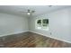 An empty bedroom with wood floors, ceiling fan, and a bright window at 2821 Regent Park Ln, Burlington, NC 27217