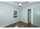 Bedroom featuring a window, closet, wood-look floors, and ceiling fan at 2821 Regent Park Ln, Burlington, NC 27217
