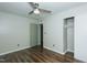 Bedroom featuring a closet, wood-look floors, ceiling fan, and doorway at 2821 Regent Park Ln, Burlington, NC 27217