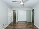 Spacious bedroom boasts hardwood floors, ceiling fan, bathroom access, and closet at 2821 Regent Park Ln, Burlington, NC 27217