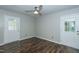 Bedroom boasting hardwood floors, ceiling fan, and natural light from back door at 2821 Regent Park Ln, Burlington, NC 27217