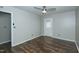 Bright bedroom featuring hardwood floors, a ceiling fan, and a door to the outside at 2821 Regent Park Ln, Burlington, NC 27217