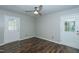 Bedroom boasting hardwood floors, ceiling fan, and natural light from a back door at 2821 Regent Park Ln, Burlington, NC 27217