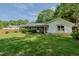 Charming single-story home featuring a well-manicured lawn, classic brick accents, and established landscaping at 2821 Regent Park Ln, Burlington, NC 27217