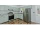 Modern kitchen with stainless steel appliances, light green cabinets, and granite countertops at 2821 Regent Park Ln, Burlington, NC 27217