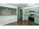 Open kitchen view from dining area with breakfast bar at 2821 Regent Park Ln, Burlington, NC 27217