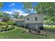Spacious backyard with a patio featuring outdoor seating, landscaping and mature trees for shade at 3509 Crofton Ct, Raleigh, NC 27604