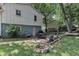Beautiful backyard with a patio, outdoor seating, lush landscaping, and ample shade from mature trees at 3509 Crofton Ct, Raleigh, NC 27604