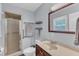 Bathroom featuring a walk-in shower, tile flooring, vanity and mirror at 3509 Crofton Ct, Raleigh, NC 27604
