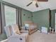 Comfortable bedroom with chair, crib, and decor at 3509 Crofton Ct, Raleigh, NC 27604