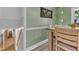 Dining area with wood table and chairs adjacent to staircase leading to lower level at 3509 Crofton Ct, Raleigh, NC 27604