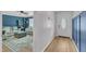 Stylish entryway showcasing wood-look floors, a decorative glass front door, and a glimpse into the living room at 3509 Crofton Ct, Raleigh, NC 27604