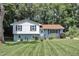 Charming split-level home featuring a well-manicured front lawn, mature trees and pleasant curb appeal at 3509 Crofton Ct, Raleigh, NC 27604