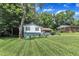 Well-maintained split-level home with spacious front lawn, mature trees, and neighborly charm at 3509 Crofton Ct, Raleigh, NC 27604