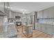 Well-equipped kitchen with stainless steel appliances, ample cabinetry, granite countertops, and a kitchen island at 3509 Crofton Ct, Raleigh, NC 27604