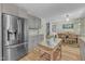 Spacious eat-in kitchen featuring stainless steel appliances, granite countertops, and easy access to dining area at 3509 Crofton Ct, Raleigh, NC 27604