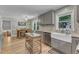 Open eat-in kitchen with stainless steel appliances, granite countertops, a kitchen island, and dining area at 3509 Crofton Ct, Raleigh, NC 27604