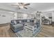 Spacious living area featuring hardwood floors, recessed lighting, and a cozy seating arrangement at 3509 Crofton Ct, Raleigh, NC 27604