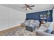 Comfortable living room with blue accent wall, stylish decor, plush seating, and bright natural light at 3509 Crofton Ct, Raleigh, NC 27604