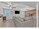 Inviting living room with a gray sectional couch, brick fireplace, and hardwood floors at 3509 Crofton Ct, Raleigh, NC 27604