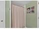 A shower stall is equipped with a neutral-toned curtain at 3509 Crofton Ct, Raleigh, NC 27604
