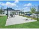 Community area with a covered pavilion, picnic tables, and outdoor game area at 380 Chesapeake Commons St # 129, Garner, NC 27529