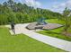 Community playground with a slide and climbing structure surrounded by benches at 380 Chesapeake Commons St # 129, Garner, NC 27529