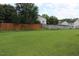 Expansive backyard featuring lush green grass and a privacy fence at 417 Downing Glen Dr, Morrisville, NC 27560