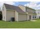 View of house from the backyard with well-maintained lawn and patio area at 417 Downing Glen Dr, Morrisville, NC 27560