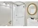Modern bathroom featuring glass-enclosed shower, updated vanity, and stylish mirror at 417 Downing Glen Dr, Morrisville, NC 27560