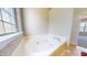 Corner garden tub next to window for a relaxing bath experience at 417 Downing Glen Dr, Morrisville, NC 27560