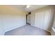 A cozy bedroom with neutral walls, carpeted flooring, a ceiling fan, and a double door closet at 417 Downing Glen Dr, Morrisville, NC 27560