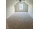 Spacious bedroom with neutral carpet, a ceiling fan, and a window for natural light at 417 Downing Glen Dr, Morrisville, NC 27560