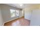 This is a well-lit bedroom featuring an open entry and hardwood floors at 417 Downing Glen Dr, Morrisville, NC 27560