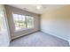 Bedroom with neutral walls, a ceiling fan, and a large window that allows for plenty of natural light at 417 Downing Glen Dr, Morrisville, NC 27560