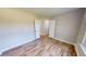 A bright bedroom with an open closet and wood-look flooring at 417 Downing Glen Dr, Morrisville, NC 27560