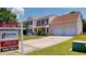 Two-story home with a two-car garage and a 'For Sale' sign, showcasing the property's availability at 417 Downing Glen Dr, Morrisville, NC 27560