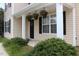 Inviting front porch with decorative plants and charming curb appeal at 417 Downing Glen Dr, Morrisville, NC 27560