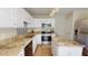 Bright kitchen with white cabinetry, stainless steel appliances, granite countertops, and a stylish backsplash at 417 Downing Glen Dr, Morrisville, NC 27560