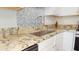 Close-up on sink and granite countertop, enhanced by a modern faucet and backsplash at 417 Downing Glen Dr, Morrisville, NC 27560