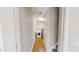 A hallway leads to a dedicated laundry area with a modern washing machine at 417 Downing Glen Dr, Morrisville, NC 27560