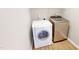 A modern laundry room featuring a white Bosch washing machine and a Samsung clothes dryer at 417 Downing Glen Dr, Morrisville, NC 27560