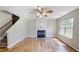 Inviting living room with hardwood floors, fireplace, and plenty of natural light at 417 Downing Glen Dr, Morrisville, NC 27560