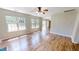 Cozy living room with wood floors and bright windows, offering ample natural light at 417 Downing Glen Dr, Morrisville, NC 27560