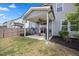 Covered back patio with a ceiling fan, outdoor furniture, and a fire pit for cozy gatherings at 4508 Valley Crest Ln, Fuquay Varina, NC 27526