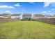 Large, fenced backyard with lush green grass, providing a safe and private area for outdoor activities at 4508 Valley Crest Ln, Fuquay Varina, NC 27526